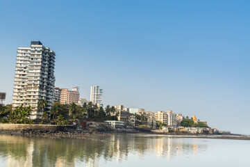 Modern buildings at the coastline next to  Haji Ali Mosque, built in 1431 and is one of the famous mosques in India
