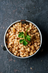 fried white beans in a metallic lunch box