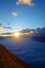 Cloudy sunrise ridge view from the Augstmatthorn in the Bernese Oberland. Overlooking the scenery of lake Brienz, Brienzersee, Emmental Alps, Switzerland