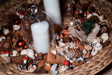 Fototapeta na wymiar Decoration and winter items related to Christmas next to some candles