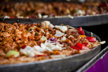 Pakistani cuisine Street food - rice, curry and bread selection.