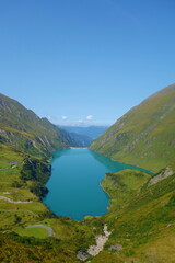 Fototapeta na wymiar Panoramic view of Reservoir Mooserboden embedded in the impressive mountains of the Hohe Tauern near Kaprun, Austria.