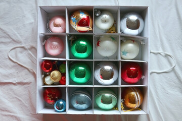 Colorful Christmas ornaments organized in a box. Top view.