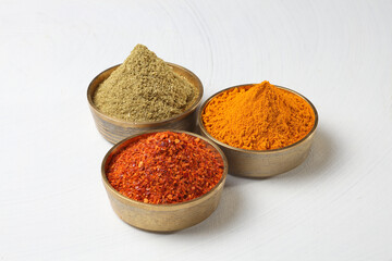 different spices in a  metal bowl.