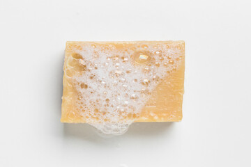 Soap with foam on a white background Soap used in everyday life, including washing, bathing