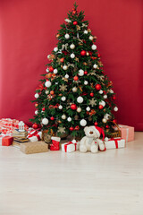 Fototapeta na wymiar New Year's Eve Christmas Tree With Gifts Decor House 2021 2022