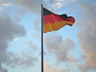 German national flag in the cloudy sky