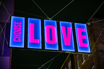 Close up of CHOOSE LOVE illuminated sign as part of the Carnaby Street 2020 Christmas lights during the COVID 19 pandemic