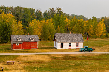 Rustic farm buildings and equipment. Bar U Ranch National Historic Site, Alberta, Canada © David