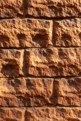 Brown brick wall. Brown brick texture. Uneven brickwork