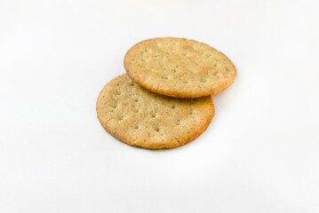 Selective focus of a stack of biscuits isolated on white background.