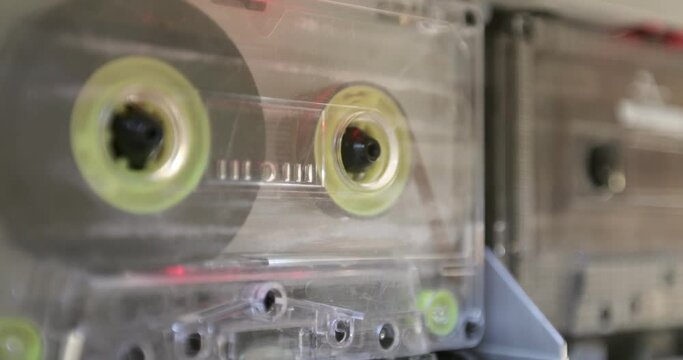 Tape Recorder Plays Transparent Audio Cassette. Closeup.