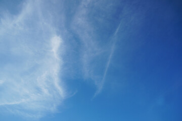 Cirrus clouds and blue sky background.