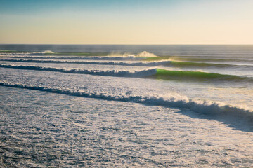 Big and long waves in ocean. Ideal swell for surfing