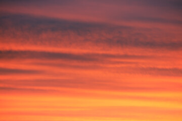 sunrise/sunset clouds in sky with colourful red and orange hues. Beautiful background.