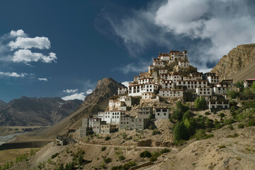 Fototapeta premium Ancient Key monastery flanked by Himalayas and Spiti river, Kaza,, India.