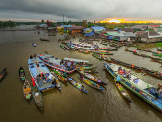 Banjarmasin Indonesia November 28, 2020 : Famous floating market in Indonesia, Lok Baintan floating market, tourists visiting by boat. Aerial Traditional Floating Market in Indonesia.
