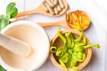 Alternative medicine herbal organic capsule with vitamin E omega 3 fish oil, mineral, drug with herbs leaf natural supplements for healthy good life.