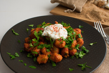 Traditional Turkish Food, Fellah Kofte. Bulgur meatballs with tomato paste and garlic.