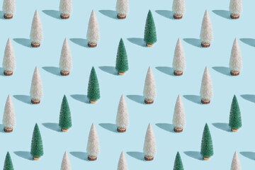 Minimal pattern with Christmas trees green and white shiny colors . New Year concept.