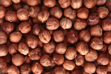 Hazelnut kernels, without shells, in large quantities. Hazelnut. Natural product. The view from the top. Copy space.