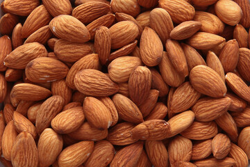 Almonds, without shells, in large quantities. Natural product. The view from the top. Copy space.