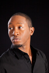 Obraz premium Pensive Black man looking thoughtful
