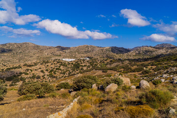 Fototapeta na wymiar Panoramic view of stony landscapes and unique geological formations near Volax, Tinos - Cyclades, Greece