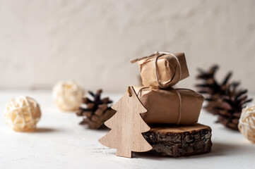 Wooden Christmas tree with gifts on a white background.Christmas new year.