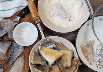 Fried river fish pike on the background of the kitchen table. Home cooking.Food background.