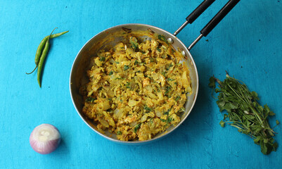 Cooked Egg bhurji and raw ingredients 