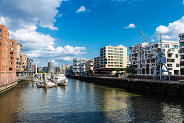Fototapeta na wymiar Modern buildings and a pier in HafenCity, Hamburg, Germany