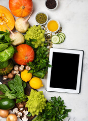Tablet computer with ingredients for cooking healthy food - 395791079