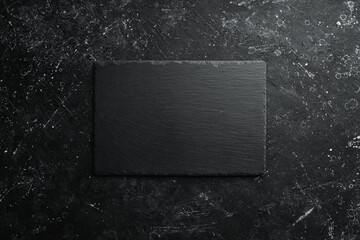 Slate black stone plate. Top view. Free copy space.