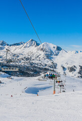 Elevator cabin about the station in ski resort. View of mountains, Pyrenees, Andorra, winter sunny day