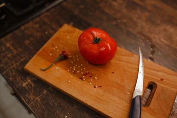 red tomato on the board