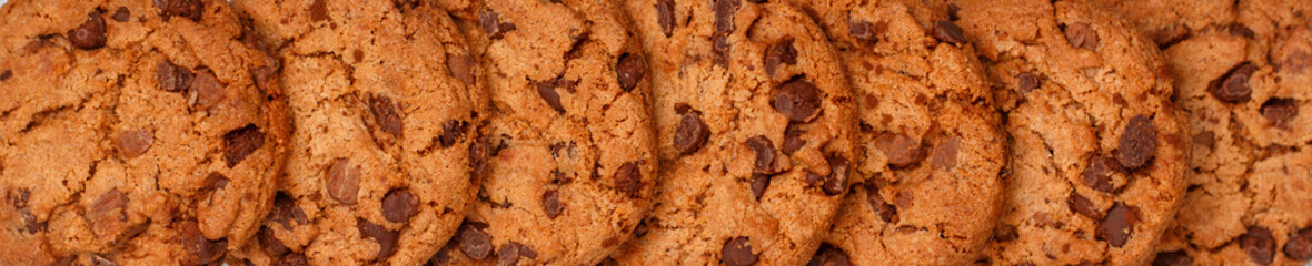 Freshly baked homemade crunchy cookies with chocolate chips, peanut butter or salted caramel. A...