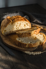 Various rustic bread on a wooden board. Healthy food and farming concept