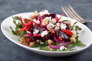 on a gray background  a plate with beet salad