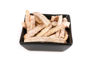 Dehydrated taro snack sticks in a bowl isolated over white