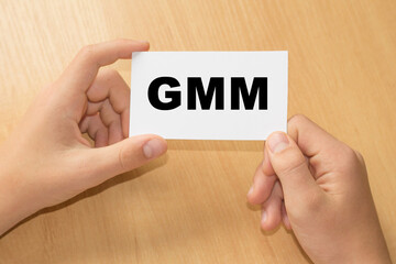 Card with text CMM on hand. Concept words Business concept, copy space.