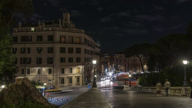 Night time lapse of the Roman traffic in Piazza d'Aracoeli from the Cordonata Capitolina. Rome, Lazio, Italy, Europe
