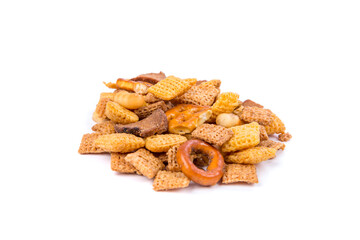 Cereal holiday mix with pretzels and crunchy salty pieces isolated over white
