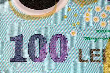 Selective focus on detail of lei banknotes. Close up macro detail of romanian lei banknotes, 100 lei isolated. World money concept, inflation and economy concept