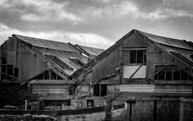 Dilapitdated Old Warehouses with Old Wooden Trawler in Black and White