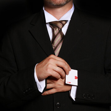 Person cheating while playing cards