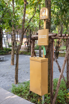 Pet Waste Station In Park, Dog Waste Bin And A Container With Disposal Plastic Bags.