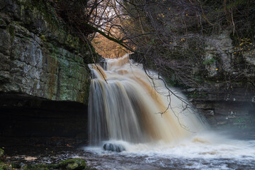 A winter blended HDR image of West Burton Falls, also know as Cauldron Falls, in the village of West Burton, Bishopdale, Yorkshire, England.