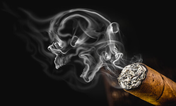 smoky skull, macabre smoke cloud with cigarette. Conceptual image anti smoking, smoking kills.