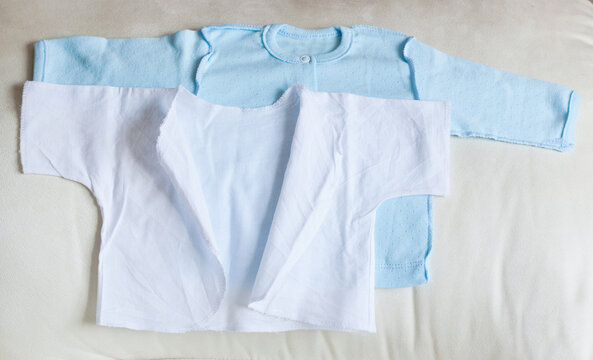 baby clothes on white